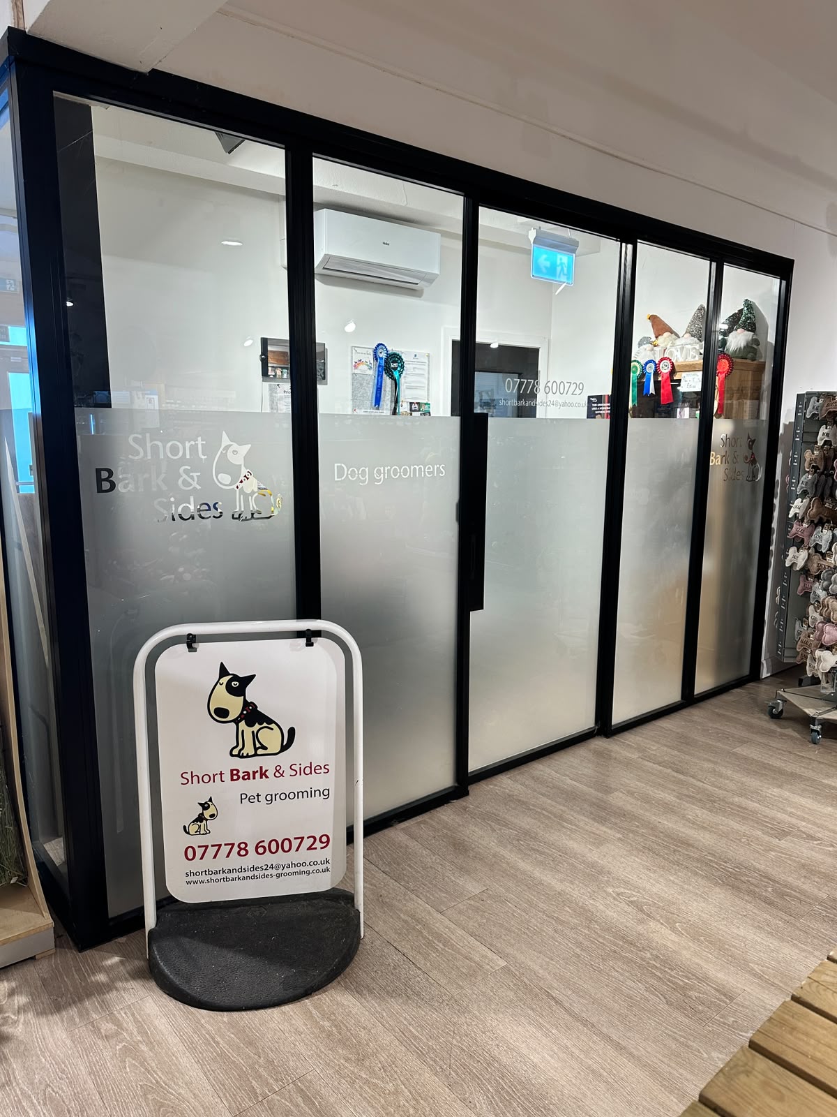 The Short Bark & Sides salon frontage and sign inside the garden centre